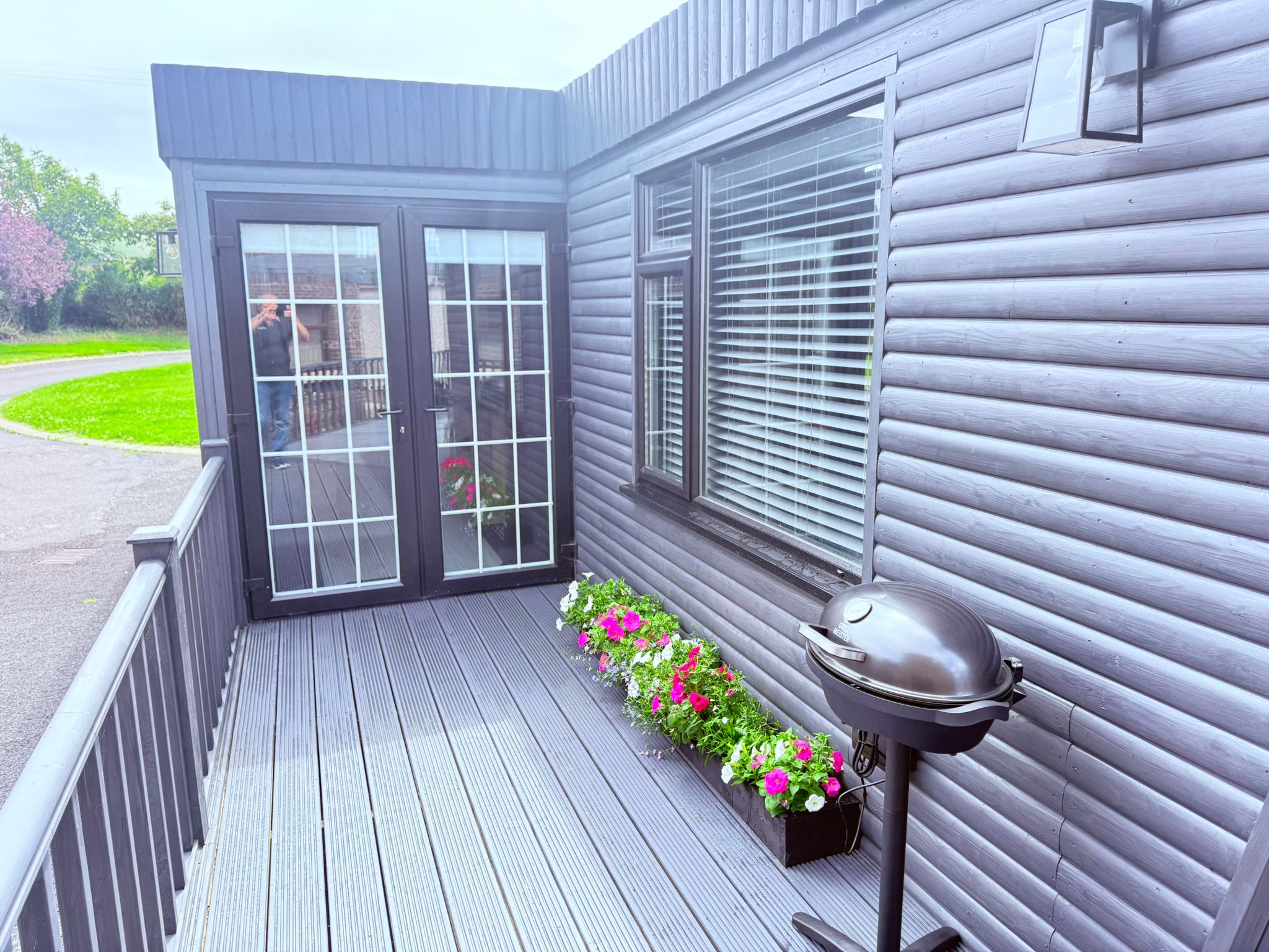 Spacious decking area with BBQ and seating